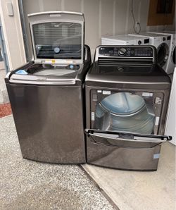 LG 5.2 Cu.Ft Mega Capacity Top-Load washer and 7.3 Cu.Ft capacity Dryer .