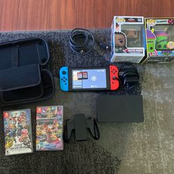 Nintendo switch with games and assesories