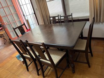 Antique dining table with 3 leaf extension and 6 matching chairs