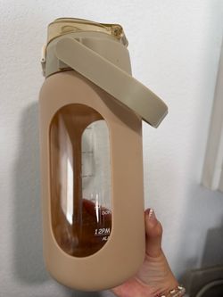 Beige glass water bottle