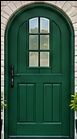 Green Wooden Arched Front Doors and windows