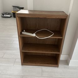 Shark vacuum cleaner and book case