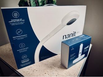 Nanit Pro with floor stand, table/multi-stand, and brand new (never used small breathing band).