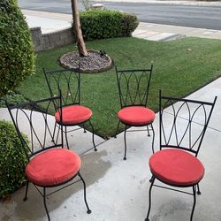 Four Wrought Iron Chairs