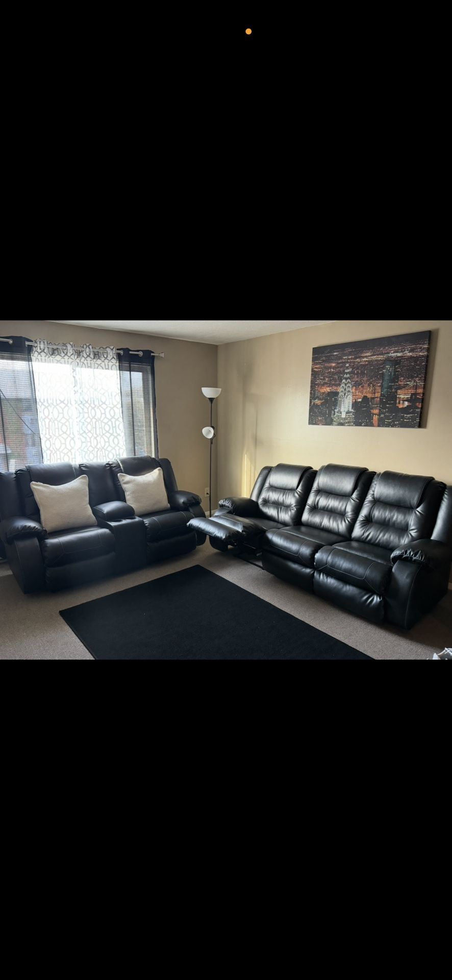 Ashley Furnitures Black Leather Reclining Couch Set.