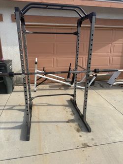 Very nice and strong squat rack with 7 ft Olympic bar. Perfect for squats, bench press, and pull ups. $300