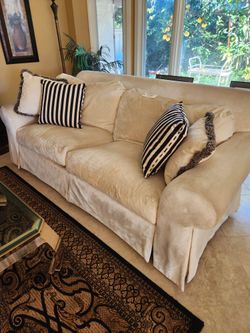 White Velvet 2 Cushion Sofa With Decorator Throw Pillows.