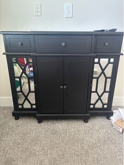 Living spaces black and mirrored cabinet