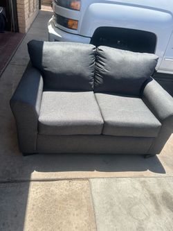 Grey love seat