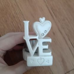 Love Figurine With Candle