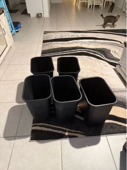 Five trash bins