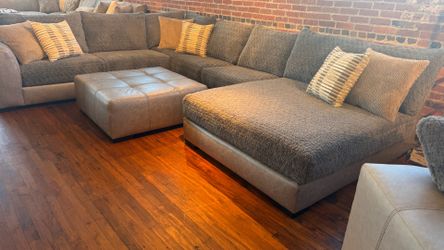 New 4 pc sectional sofa ,ottoman , pillows by Albany furniture