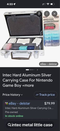Game boy aluminum carrying case with notebooks and lots of stickers.