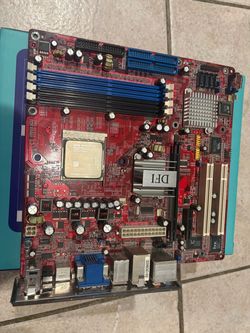 DFI RS482 Infinity Motherboard with AMD Athlon 64 CPU and fan.