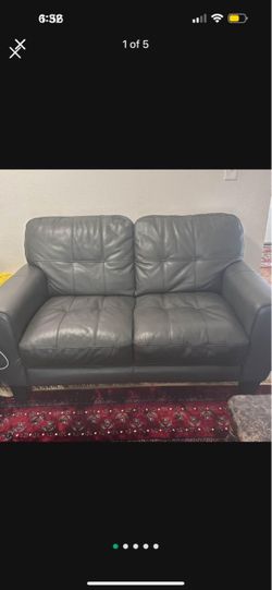 Grey leather sofa and loveseat