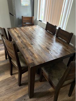 Wooden table and six chairs Wooden table and six chairs
