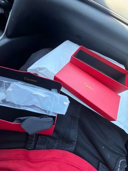 Cartier black with gold glasses