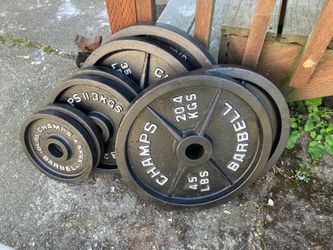 240lbs of Barbel weights 5’s - 45’s w/  Olympic bar 45lbs of weight