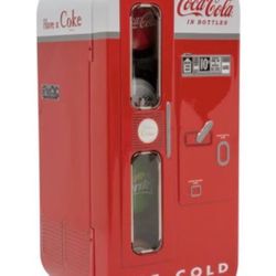 Silver Coins Shaped Like Bottle Tops In Coke Vending Machine Package
