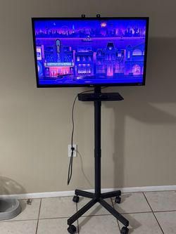 TCL 32l" Roku TV With Stand & Remote