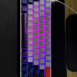 Two Keyboards. One Of The Keyboards Is A Hk61 Yellow Switches. The Other One Is A Gk61 Brown Switches.