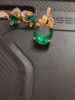 Emerald and diamond matching stud earrings and neckless  with an extra Emerald and diamond pendant
