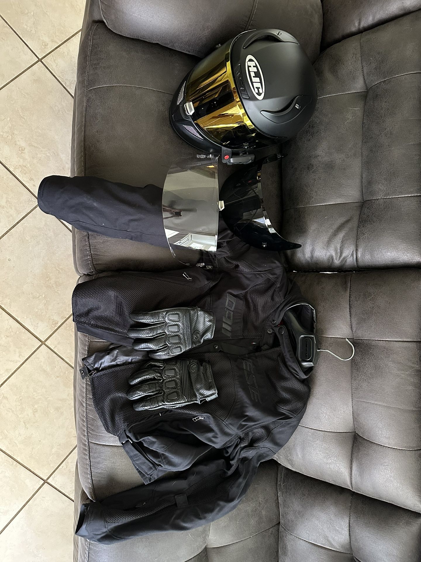 Motorcycle riding jacket, helmet and gloves