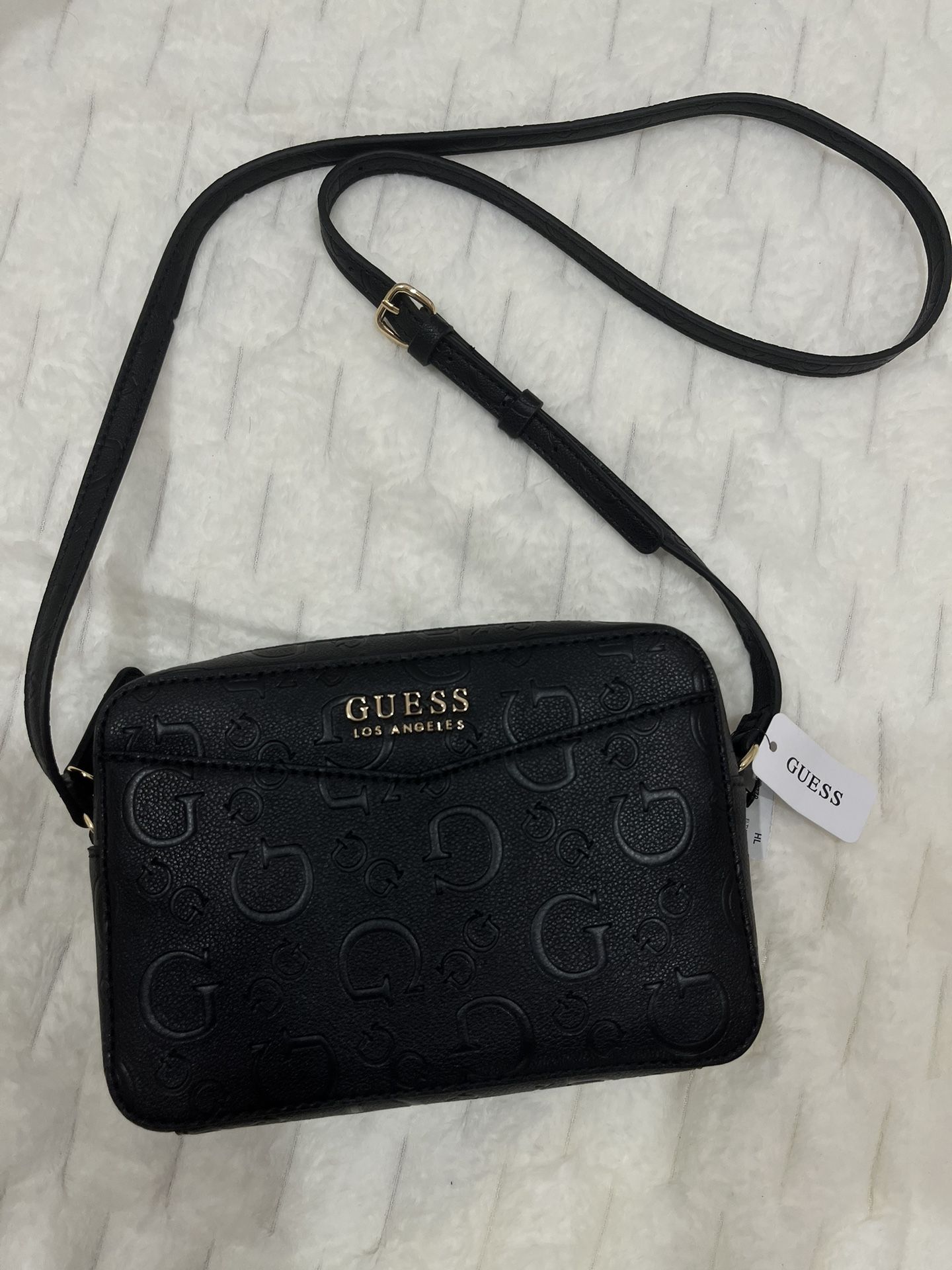 GUESS los angeles black crossbody bag with a debossed monogram pattern