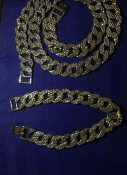 New 18 k yellow gold Cuban link chain and bracelet
