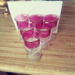 Old flashed red wine goblets