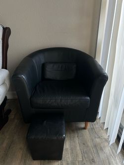 Black chair and foot rest