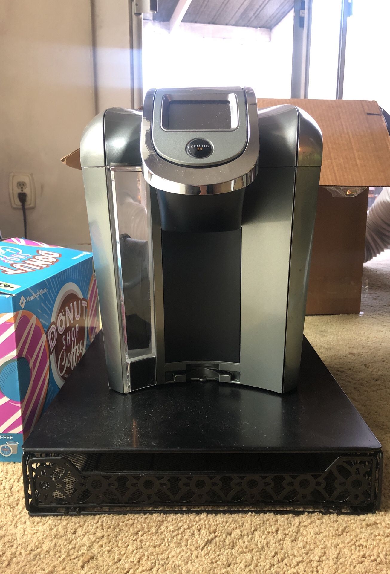 Keurig plus box of coffee pods and stand / pod holder