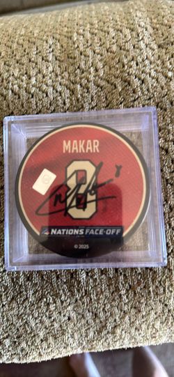 cale makar signed puck and martin necas picture