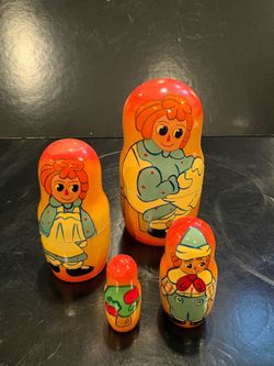 4 pc Raggedy Ann and Andy Matryoshka Nesting Dolls Set Colors are Good. Range in Height from 4.5” to 1.5”