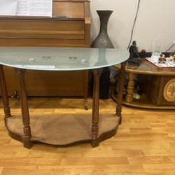 Wooden table with glass lid