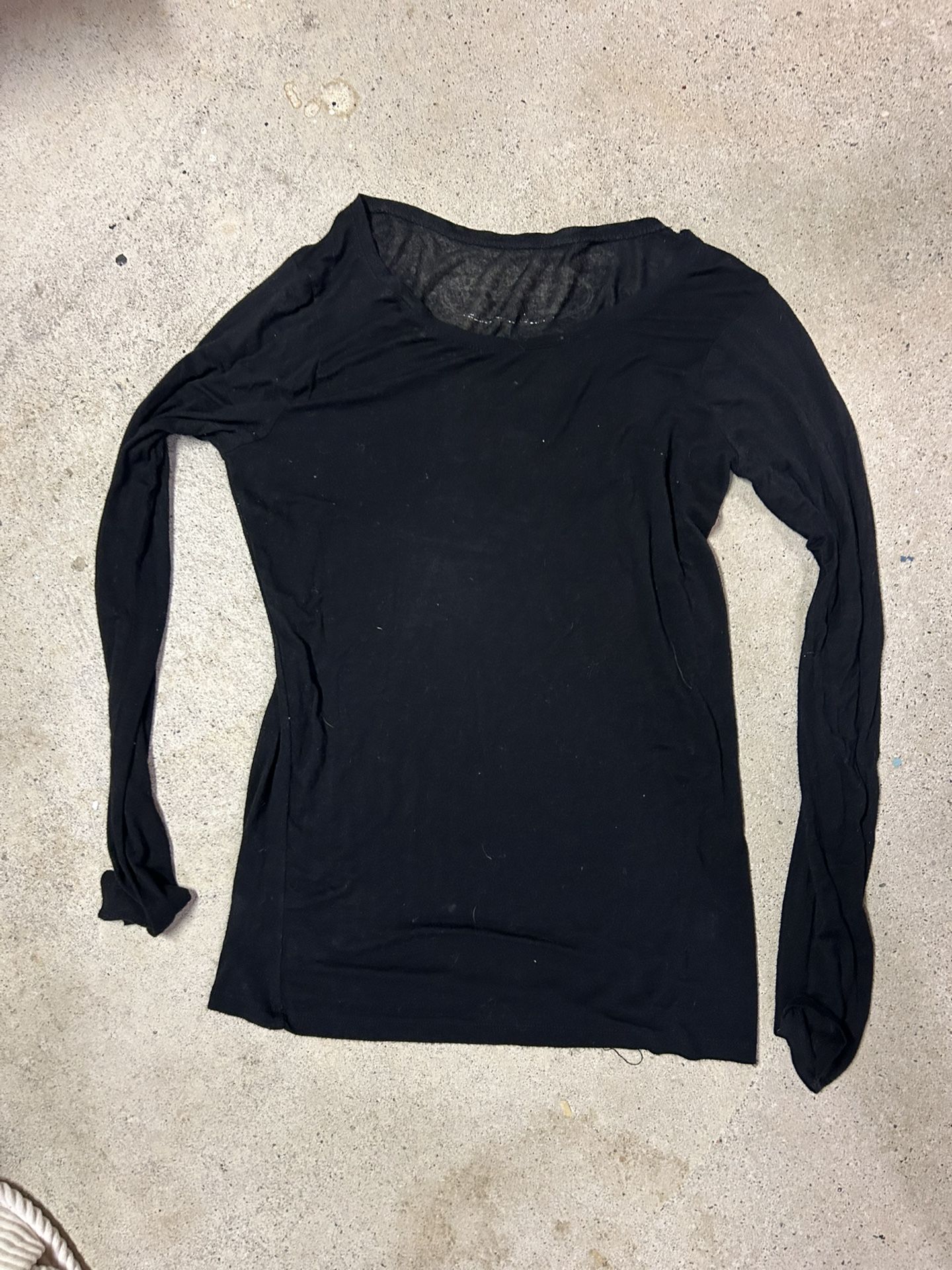 Black long sleeve top with sheer mesh detailing and a relaxed fit size small