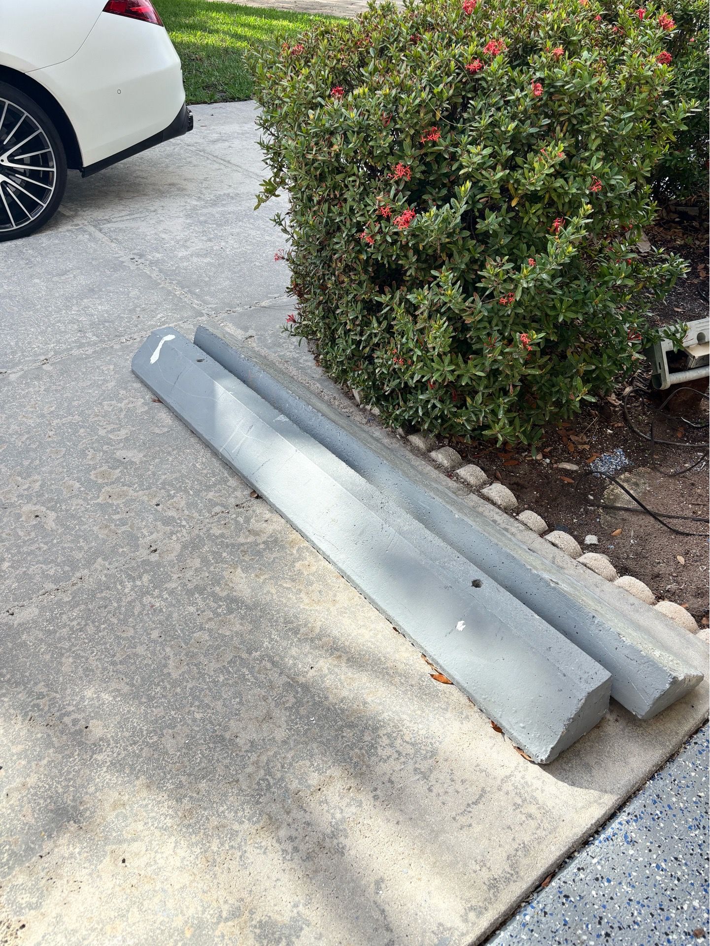 2 concrete parking blocks Please bring help with you.