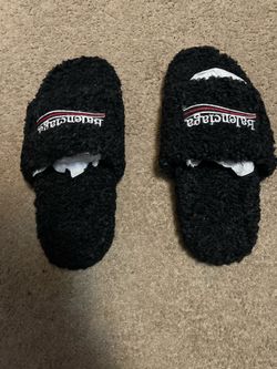 Balenciaga fur slides.