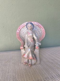 Vintage porcelain iridescent and pink woman in a whicker throne chair trinket figurine