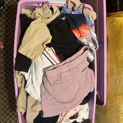 Bin Of Random Clothes And Blanket 