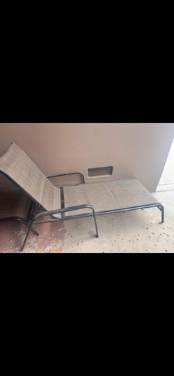 2 Brown Lounging Chairs