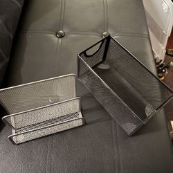 Two Mesh Holders, One Silver And One Black