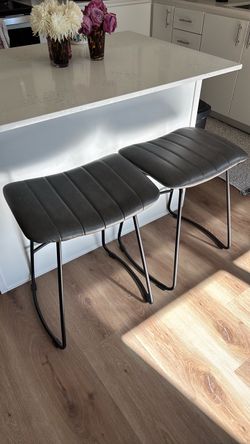 Two leather barstools