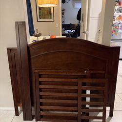 Chestnut brown DaVinci toddler bed