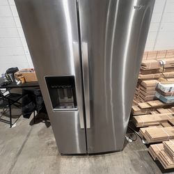 Whirlpool Refrigerator with a slight dent
