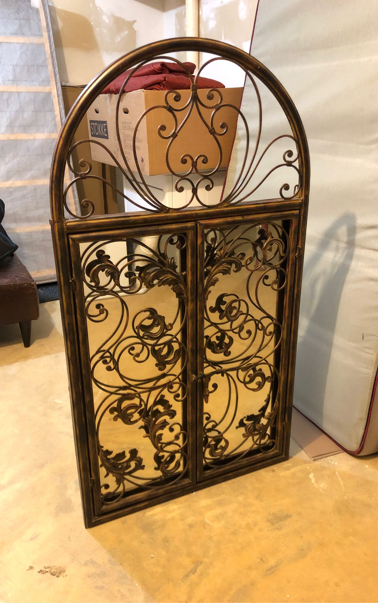 Decorative mirror with metal frame and swinging doors