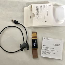 Fitbit Charge 4 Activity Tracker - Black And Gold Metal Band