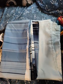 Shower curtains light blue and then a different blue