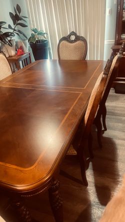 Real hardwood dining room table and 6 chairs with matching leaf.