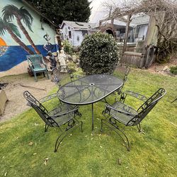 Wrought iron Table and 4 Spring Chairs